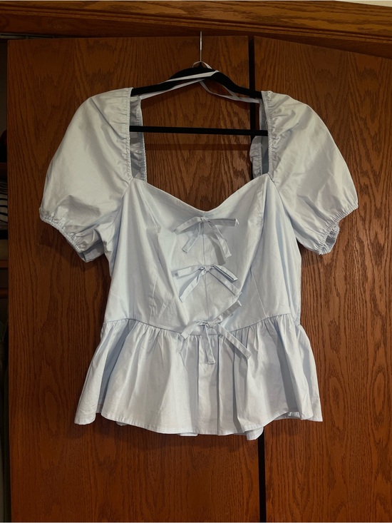 Francesca's Collections Tops - Francesca's Collections Light Blue Puff Sleeve Peplum Blouse with Front Bows